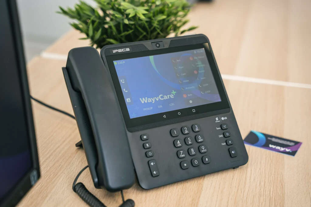 1080i phone system on desk at wayv talk