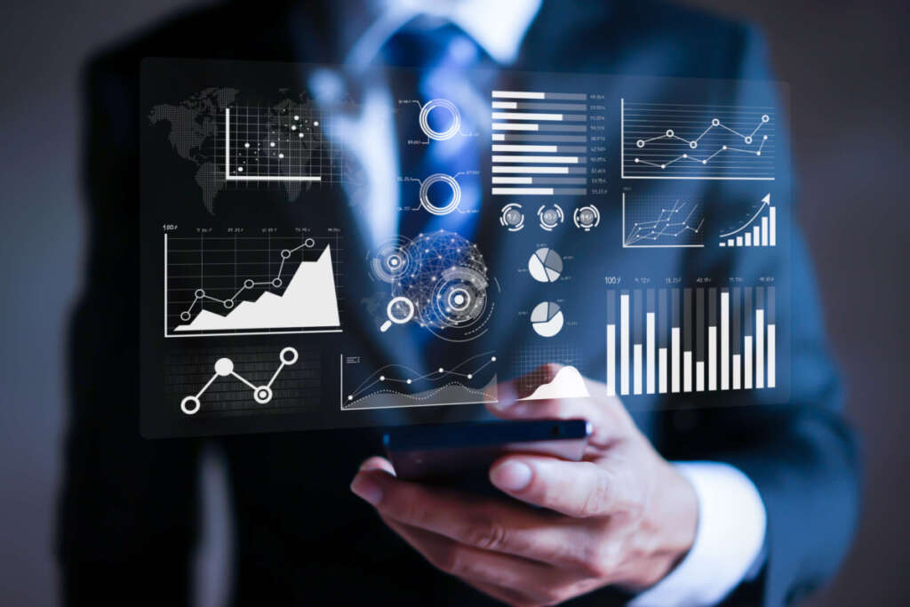 Businessman working with modern devices, Data analytics report and key performance indicators on information dashboard for Business strategy and business intelligence.